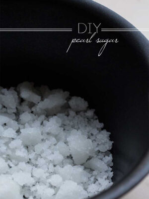 A black saucepan full of crystallized pearl sugar.