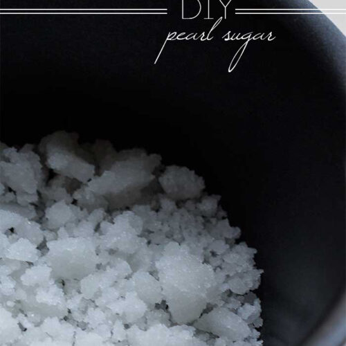 A black saucepan full of crystallized pearl sugar.