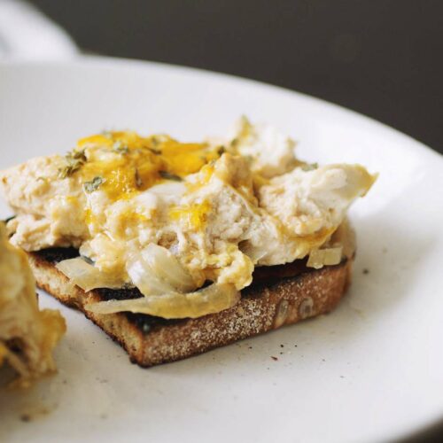 A slice of bread topped with tofu oyakodon.