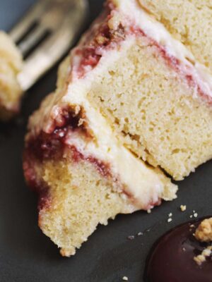 close up on a slice of strawberry lemon layer cake.