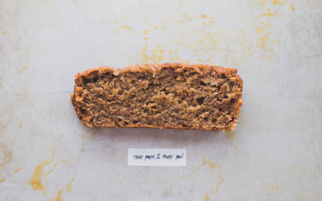Thin/short slice of golden banana bread on baking pan - Recipe by Two Peas & Their Pod