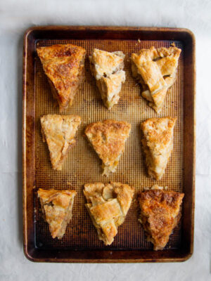 9 slices of apple pie on baking sheet for best apple pie bake off