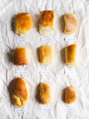 9 parker house rolls on a gray background