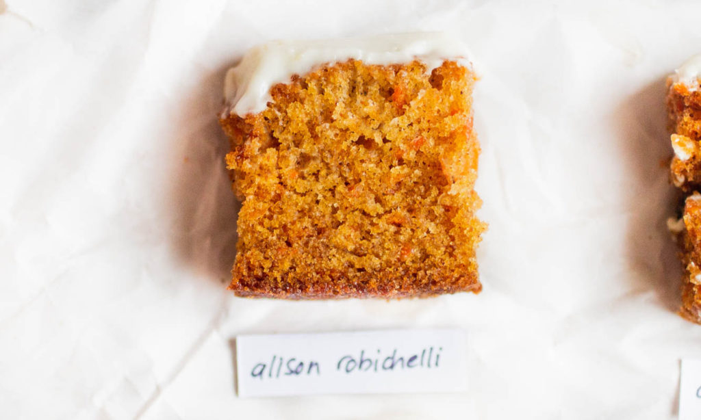 Single slice of Alison Robichelli carrot cake recipe on parchment paper