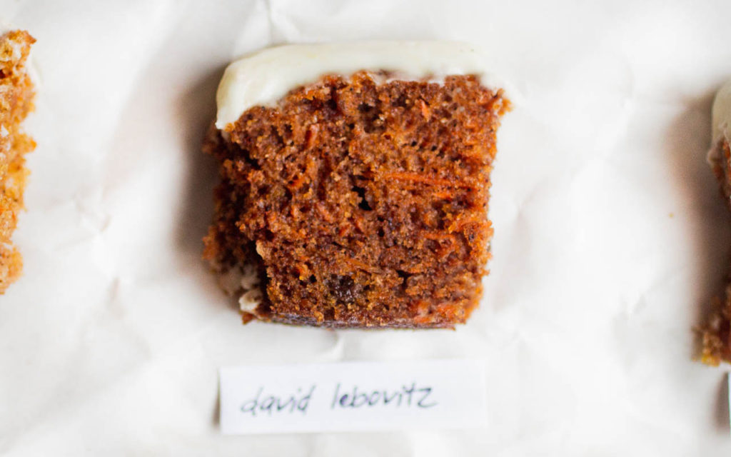 single slice of carrot cake on white parchment paper - recipe by david lebovitz