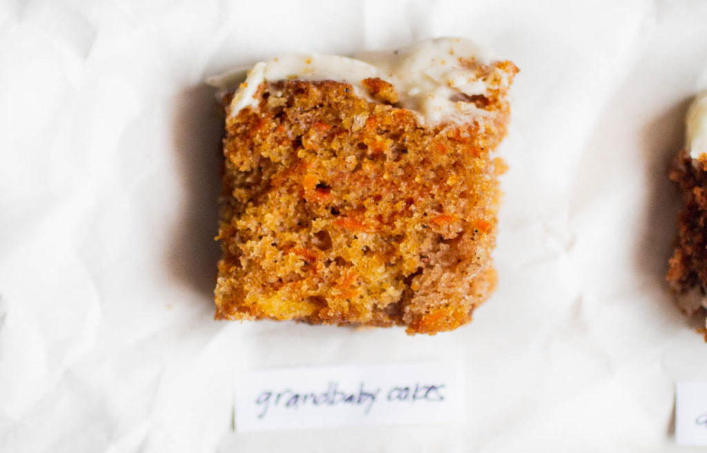 single slice of grandbaby cakes carrot cake on parchment paper