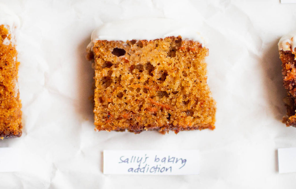 single slice of sallys baking addiction carrot cake on parchment paper