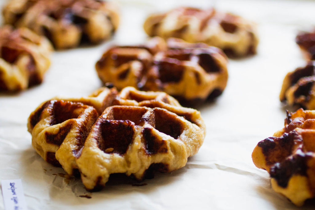 angled shot of liege waffles on a white background