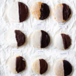 9 black and white cookies on a white background