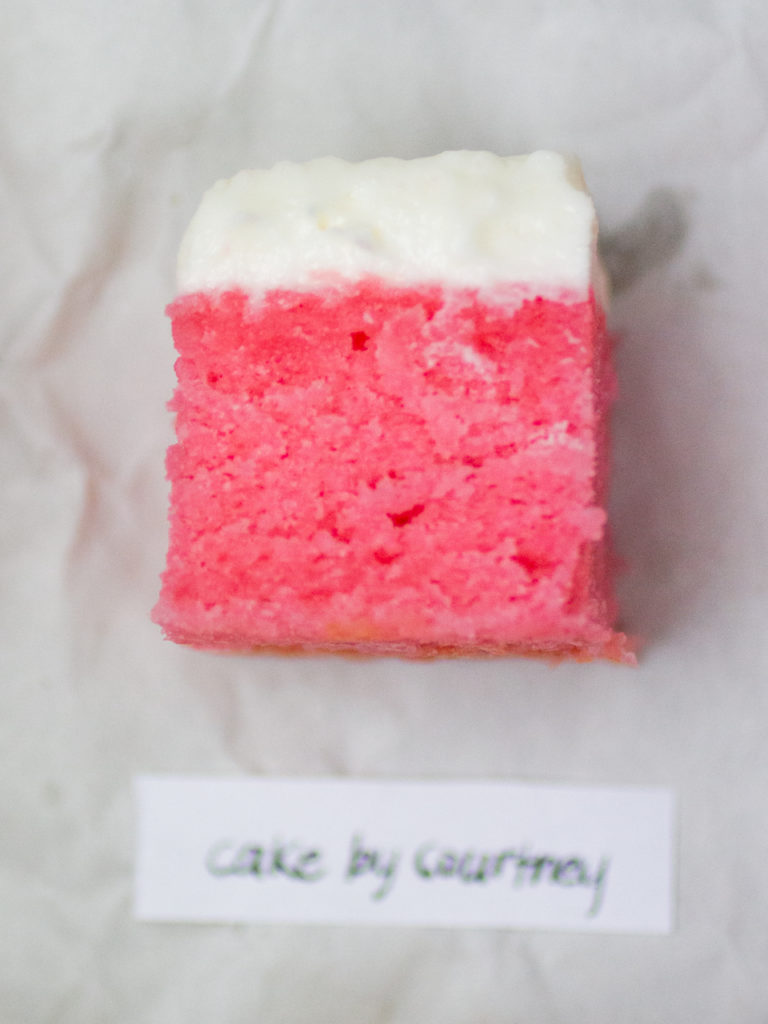 single slice of pink strawberry cake from Cake by Courtney on white parchment paper