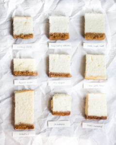 9 squares of cheesecake on a grey background