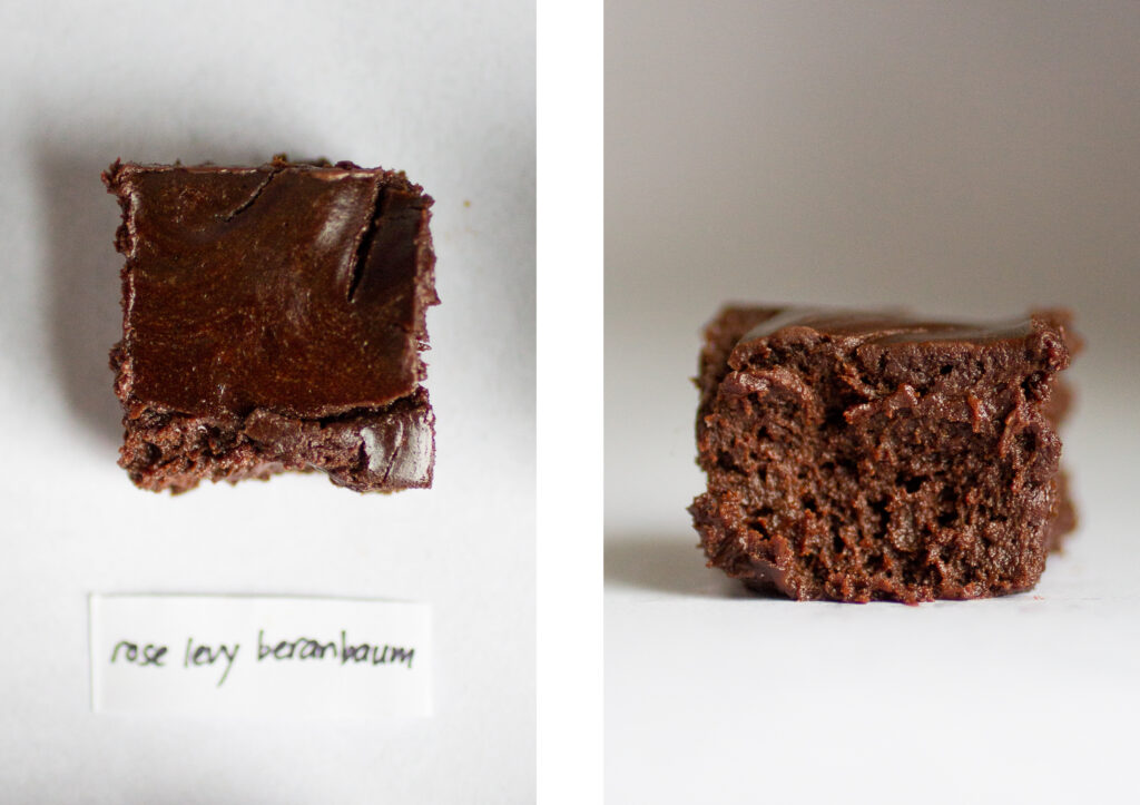 a square of flourless chocolate cake on a gray background