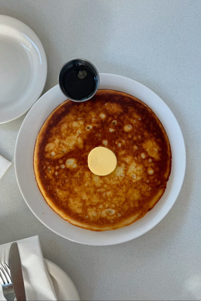 A pancake topped with butter from Leo in Brooklyn.