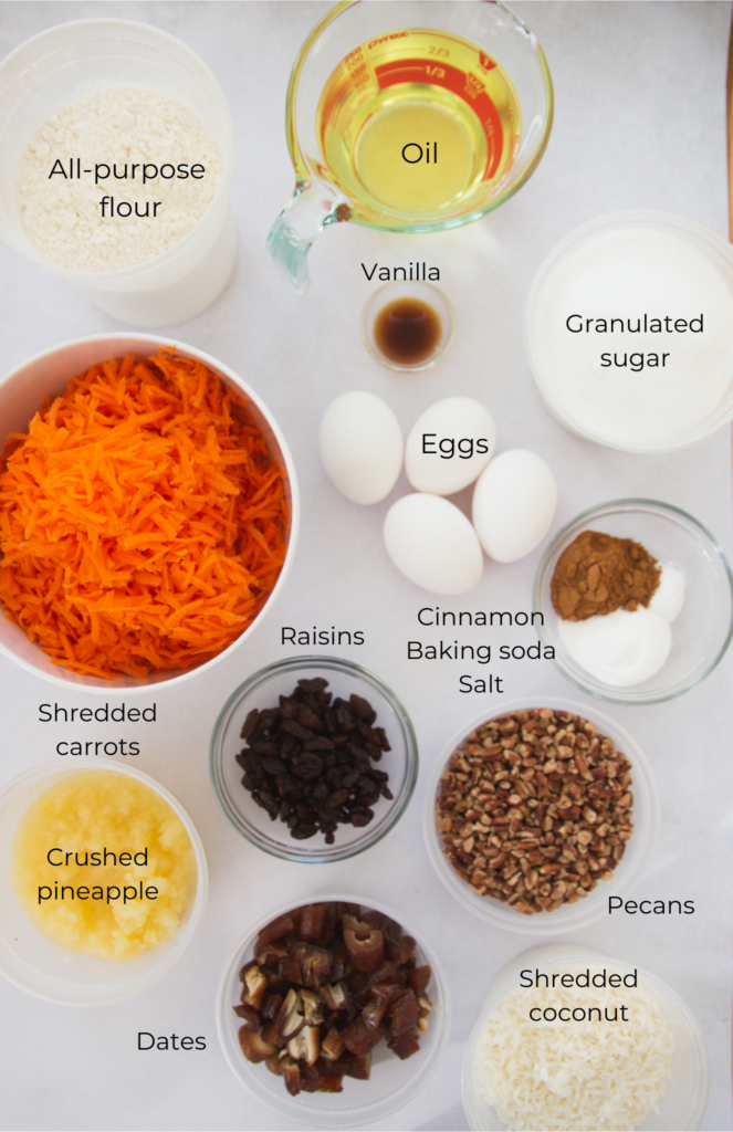 Ingredients for carrot cake: shredded carrots, crushed pineapple, raisins, eggs, vanilla, flour, sugar, cinnamon, baking soda, salt, pecans.