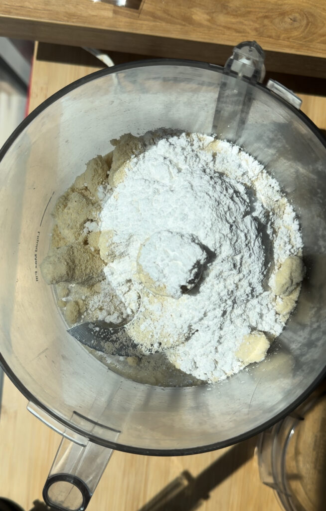 Powdered sugar and pulverized almonds in a food processor.
