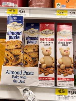 Odense brand almond paste vs. marzipan on a grocery store shelf.