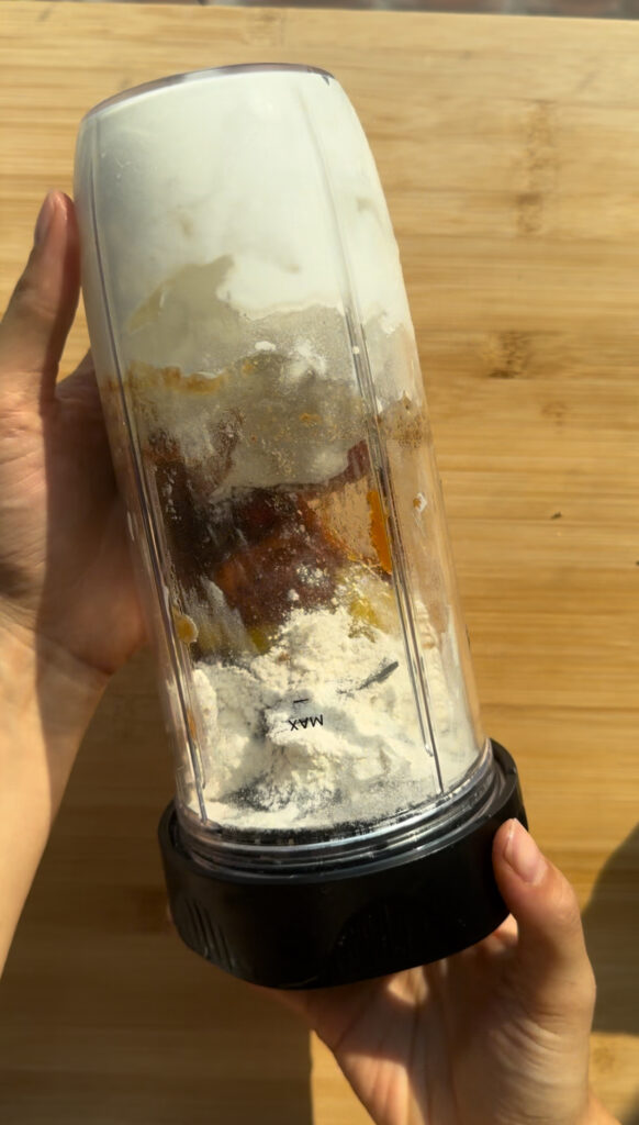 Pumpkin cottage cheesecake ingredients in a blender.