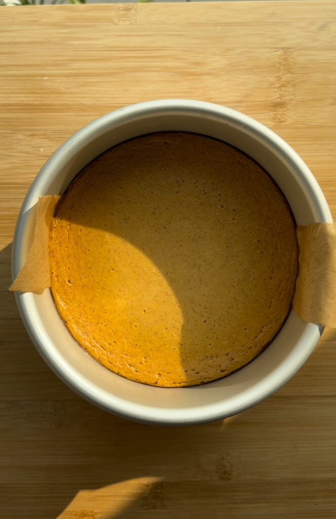 Final baked pumpkin cheesecake in a pan.