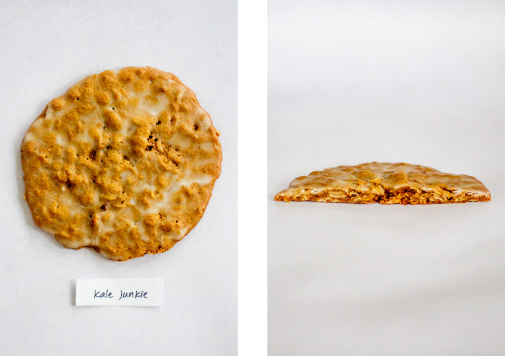 Kale Junkie\'s iced oatmeal cookie on a gray background.