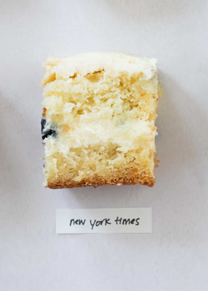 A slice of berry chantilly cake with the label "New York Times."