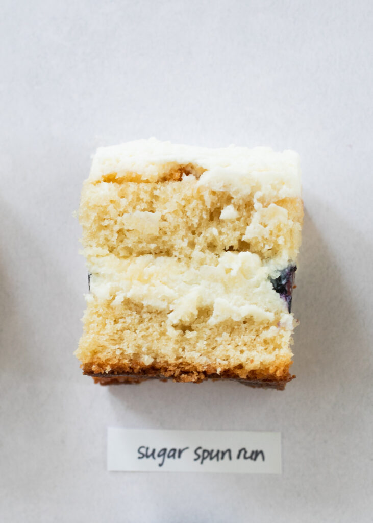 A slice of berry chantilly cake with the label "Sugar Spun Run."