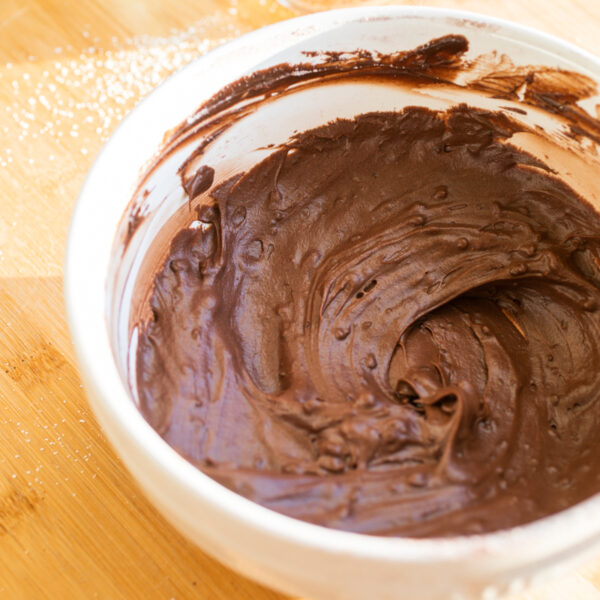 A bowl of chocolate frosting.