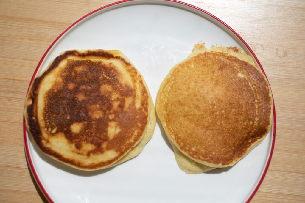 A spotty pancake on the left, a pancake with a smooth brown surface on the right.